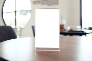 Menu frame standing on wood table in Bar restaurant cafe. space for text marketing promotion.