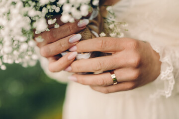 hands of the groom and the bride