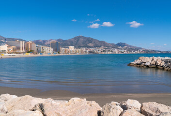 Fuengirola view Spain from Playa los Boliches to the mountains with blue Mediterranean sea and sky