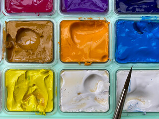 Set of watercolor-gouache paints, brush for painting