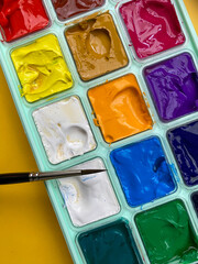 Set of watercolor-gouache paints, brush for painting