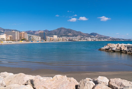 Fuengirola view Spain from Playa los Boliches to the mountains with blue Mediterranean sea and sky