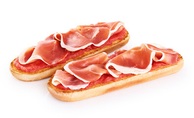 Spanish breakfast. Tostada with ripe tomato and ham (jamon) isolated on white background. With clipping path.