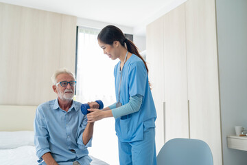 Physiotherapist man giving exercise with dumbbell treatment About Arm and Shoulder