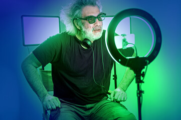 Radio host, charming influencer, records a live show with camera stuff and equipment.