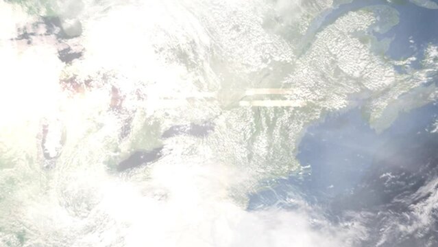 Earth zoom in from outer space to city. Zooming on Watertown, New York, USA. The animation continues by zoom out through clouds and atmosphere into space. Images from NASA