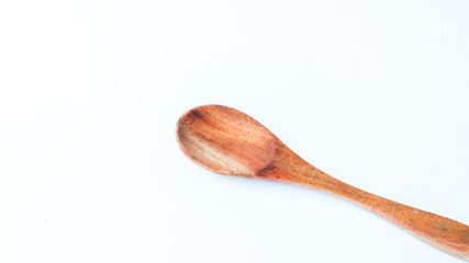 Wooden spoon and fork isolated on white background. Kitchen and cooking concept.