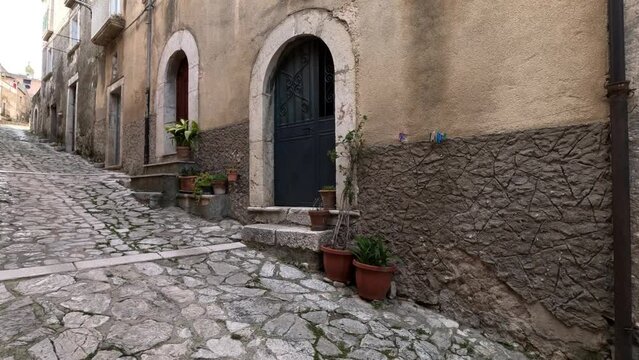 A narrow street among the old houses of Guardia Sanframondi, a small town of Benevento province, Italy.