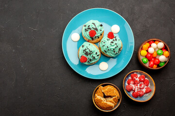 top view delicious creamy cakes with candies on dark background cake dessert biscuit candy cookies color