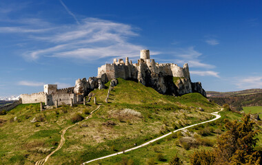 Old medieval castle on the green hill. © 9parusnikov