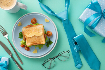 Celebrate Father's Day with a surprise breakfast for Dad! Top view of sandwich with veggies and...