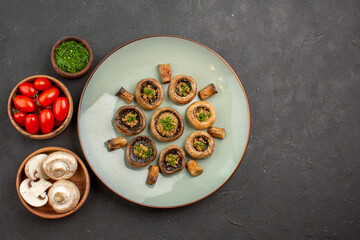 top view delicious mushrooms meal with fresh greens and tomatoes on a dark background dish dinner meal cooking mushroom