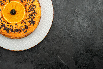 top view delicious pie with chocolate chips and orange slices on dark background tea pie dessert cake fruit biscuit
