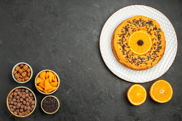 top view delicious pie with orange slices on dark-grey background sweet fruit biscuit tea cake cookie
