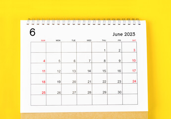 The June 2023 Monthly desk calendar for 2023 year on yellow background.