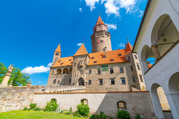 Fototapeta premium Famous medieval castle Bouzov, Czech Republic. National landmark built in 14 century. Famous tourist destination. Summer weather, blue sky.