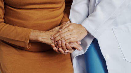 Elderly Asian female patients with cancer specialists meet by appointment to receive treatment advice for breast, cervical, lung cancer.