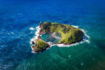 Obraz premium Azores aerial view. Top view of the Island of Vila Franca do Campo. Crater of an old underwater volcano on San Miguel island, Azores, Portugal.