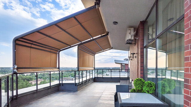 Awnings on the terrace. Penthouse on the top floor with a terrace and a gorgeous view of the forest.