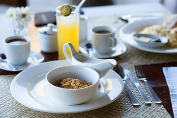 Delicious breakfast with cereals, milk, fruit juice and coffee
