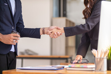  A group of businesspeople and investors meet to discuss market's success in past quarter. idea of setting up a marketing consulting team and working together as a team made it a success.
