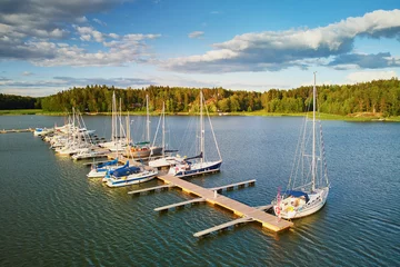 Fotobehang Noord-Europa Scenic aerial view of colorful boats near wooden berth