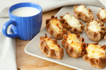 Traditional karelian pasties and cup of milk for breakfast