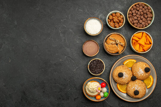 top view sweet cookies with chips and orange slices on dark background fruti cookie biscuit sweet pie cake