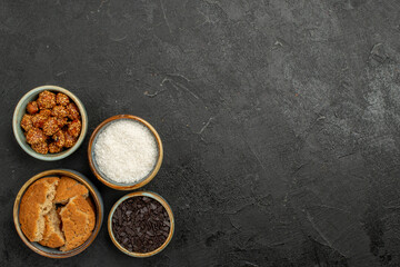 top view sweet nuts with sliced cookies on a dark background cookie biscuit candy tea