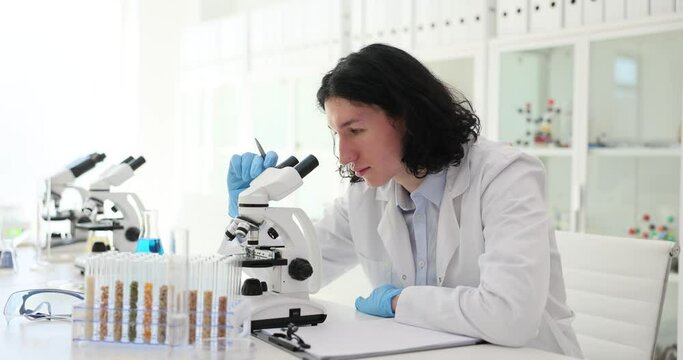 Lass test tubes with food additives cereals and grains in laboratory. Qualitative and quantitative determination of genetically modified organisms GMO of plant origin