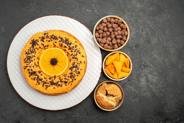 top view tasty sweet pie with orange slices on dark background pie cake dessert tea sweet biscuit
