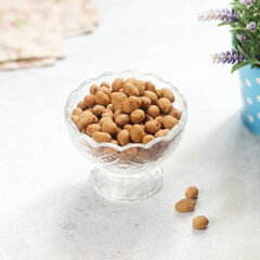 peanuts wrapped in flour, eggs and spices, which are fried, have a textured shape, with a crunchy, crunchy and savory taste. in Indonesia usually called as egg nuts or Kacang telur