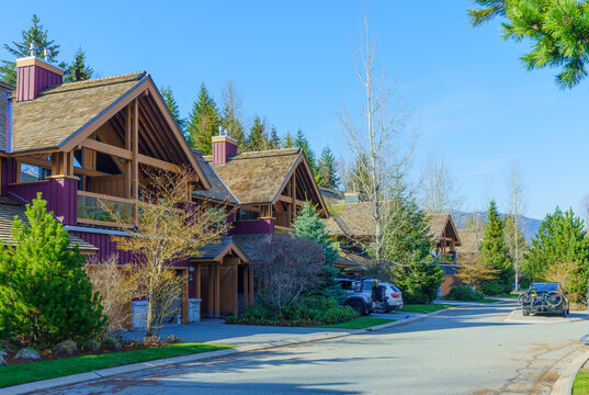 Cedar-roofed townhomes in Whistler, BC, during early Spring.