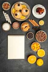 top view yummy cookies with cup of tea and orange slices on dark floor cake pie sugar dessert biscuit tea