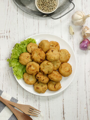 Perkedel tahu or fried tofu patties. Made of mixture mashed tofu, small amount of tapioca flour, spring onion, egg, salt and pepper and deep fried.