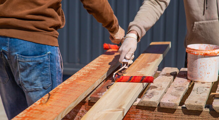 Treat the wooden board with an antiseptic. Selective focus.