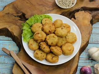 Perkedel tahu or fried tofu patties. Made of mixture mashed tofu, small amount of tapioca flour, spring onion, egg, salt and pepper and deep fried.