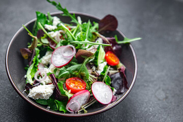 salad cheese green leaves vegetable radish, tomato, cucumber meal food snack on the table copy space food background rustic top view 
