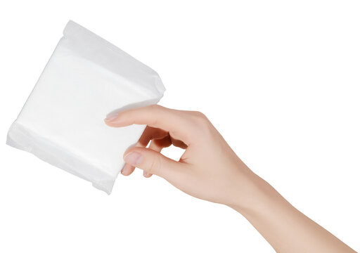 Female hand holding a sanitary pad for menstruation. Concept: female's hygienic product for period's day. Woman healthcare. Monthly intimate hygiene.