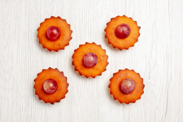 top view yummy little cakes for tea on white background dessert biscuit tea cake pie cookie
