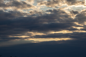 Sky replacement dramatic gray clouds lined with orange 