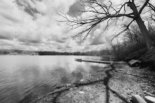 Canoe On The Boat Pier By The Lake On A Chilly Fall Day