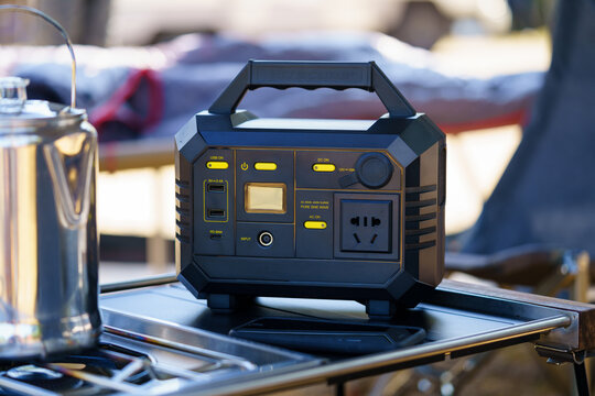 Power station, camping equipment. Lithium ion battery charger for outdoor activity and emergency. Soft and selective focus on main object.