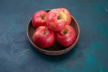 front view fresh red apples mellow and fresh fruits on dark-blue desk fruits fresh mellow ripe tree