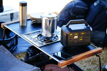 Power station, camping equipment. Lithium ion battery charger for outdoor activity and emergency. Soft and selective focus on main object.