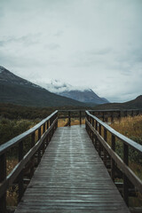 calm wooden bridge over lake in Lapataia Bay, Ushuaia, Tierra del Fuego. 