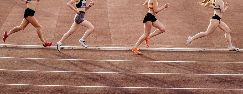 four female athlete runners middle-distance running race, summer athletics championships