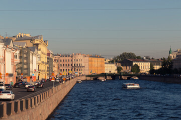 Fototapeta premium St. Petersburg, view of the river on a summer day. Houses along river on an embankment 