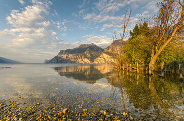 City of Riva del Garda by Garda lake in Italy. View from the lake shore