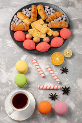 top distant view yummy cakes with crackers french macarons and cup of tea on white background cake biscuit cookies sugar sweet pie